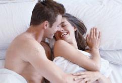 Couple laughing in bed